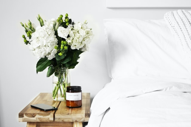 Floral arrangement on a nightstand.